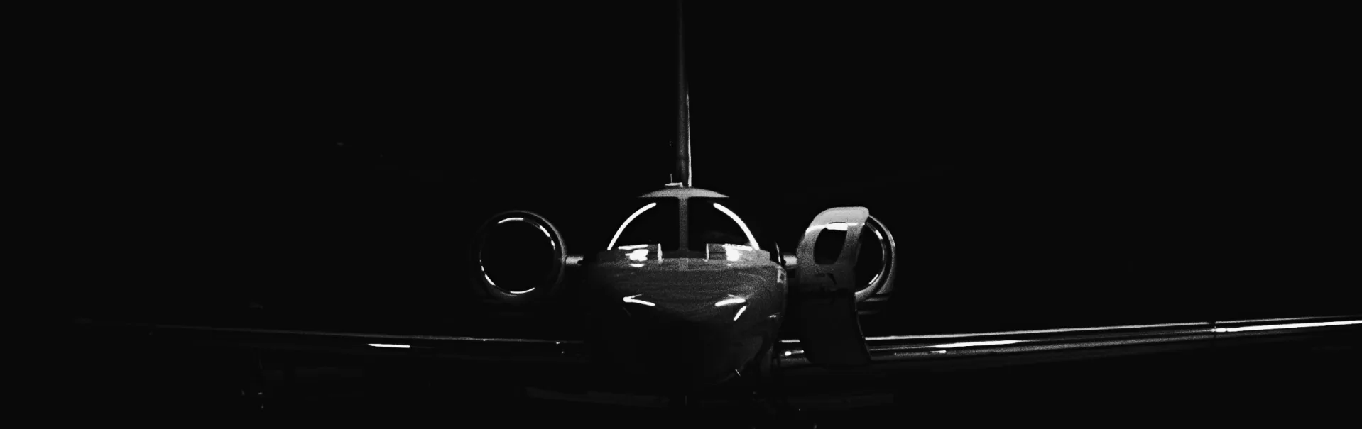 Black and white image of a modern aircraft cockpit, representing Cockpit-IT GmbH’s expertise in next-generation EFB systems for operational efficiency and safety.