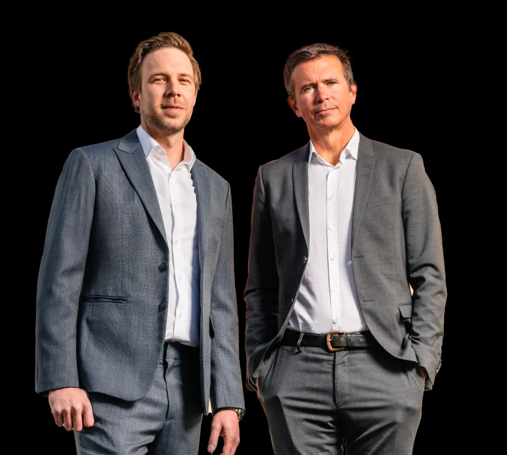 Founders and CEOs of Cockpit IT standing together in formal attire, representing leadership in aviation technology.